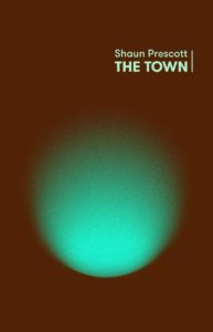 Book cover of Shaun Prescott's 'The Town'. The cover is brown, with a green orb of light on the front.