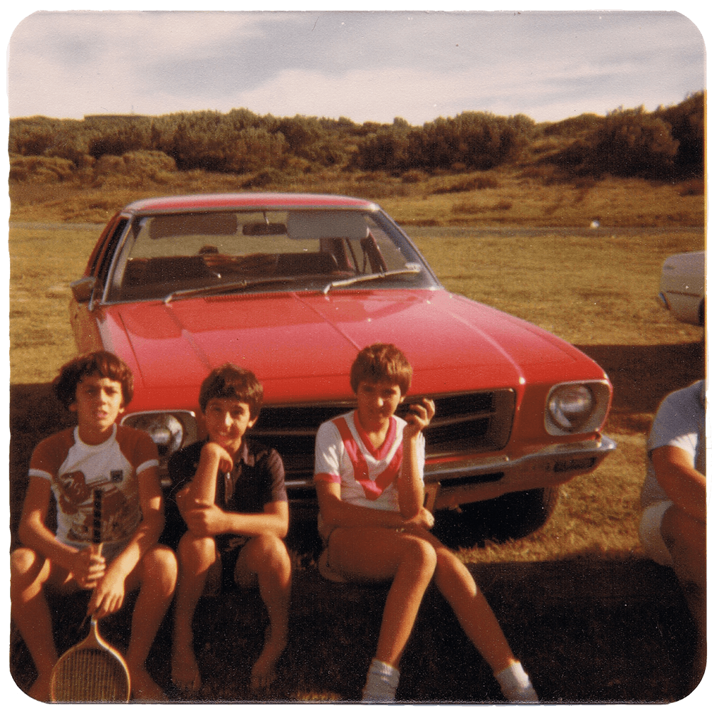 3 children in front of a Holden Belmont in the 1980s